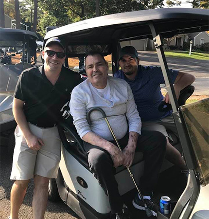 Jack and golfers in golfcart
